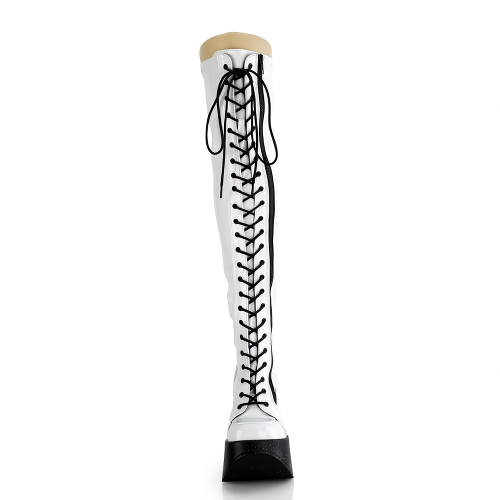 Demonia Holo Star Platform Wedge Thigh-High Boots in iridescent white with lace-up design and star platform.