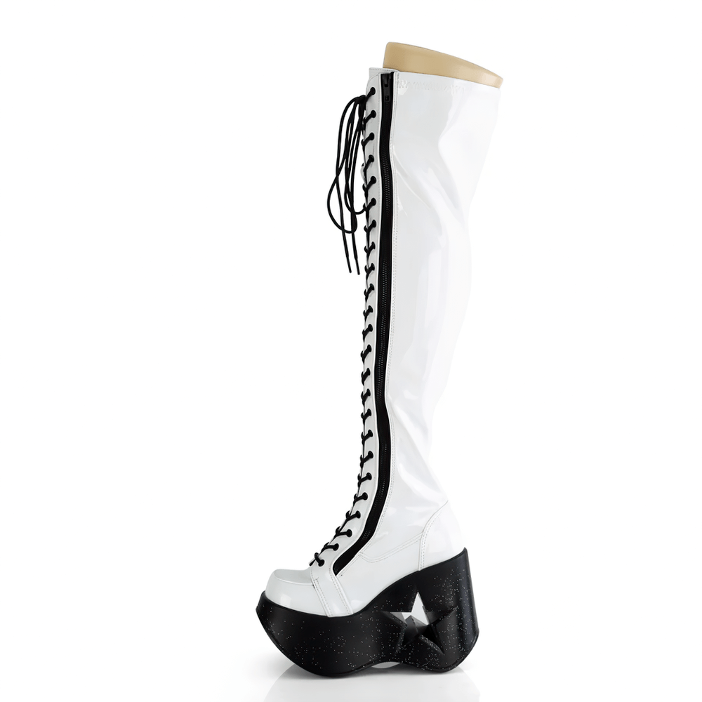 Iridescent white thigh-high Demonia boots with star wedge and lace-up design, featuring a stunning platform.