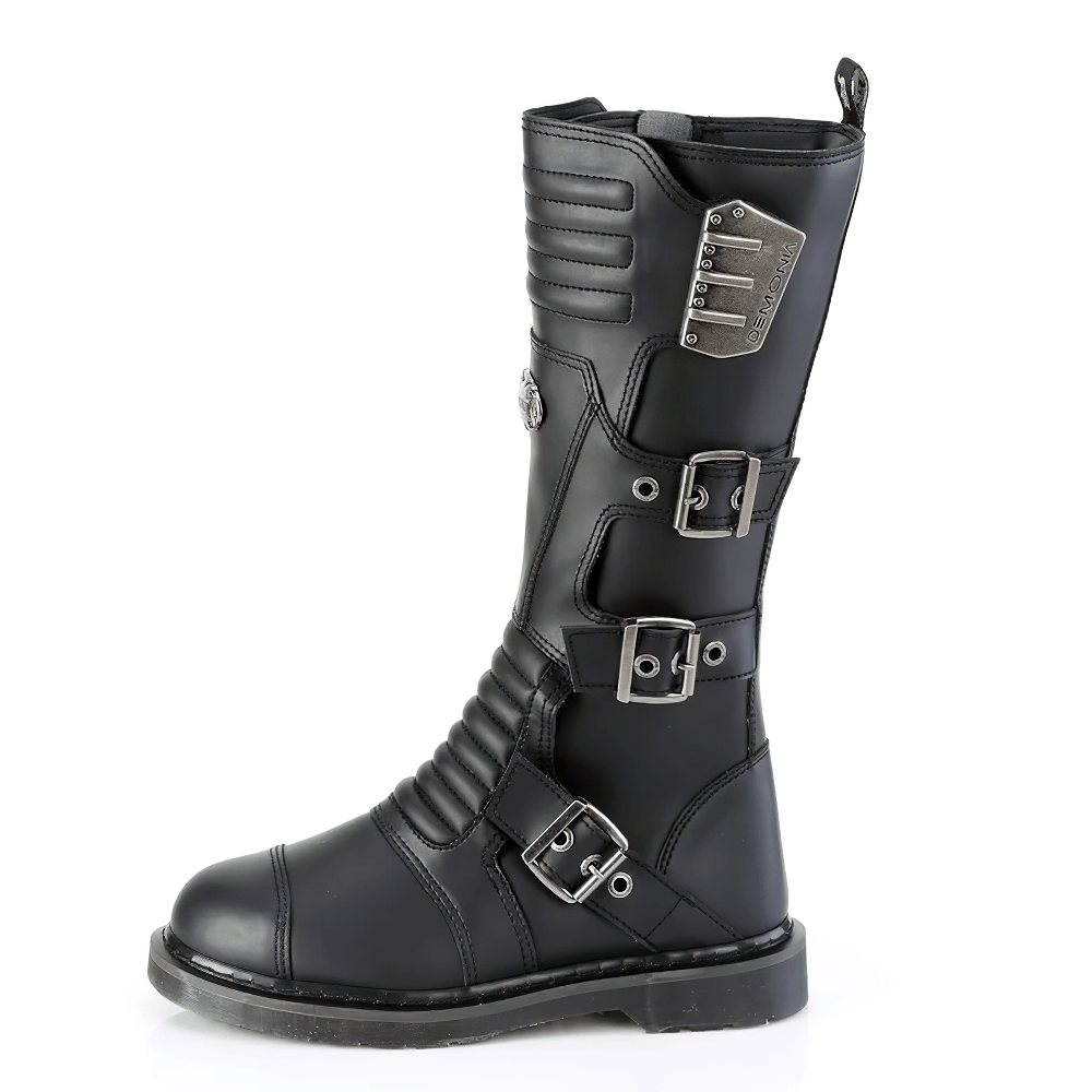 Demonia knee high combat boot in black vegan leather with buckle straps and quilted shield design.