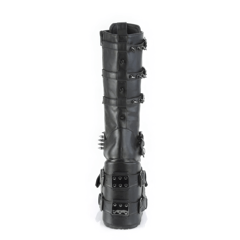 Stylish Demonia knee-high platform boots featuring spiked buckle straps and metal details for bold alternative fashion.