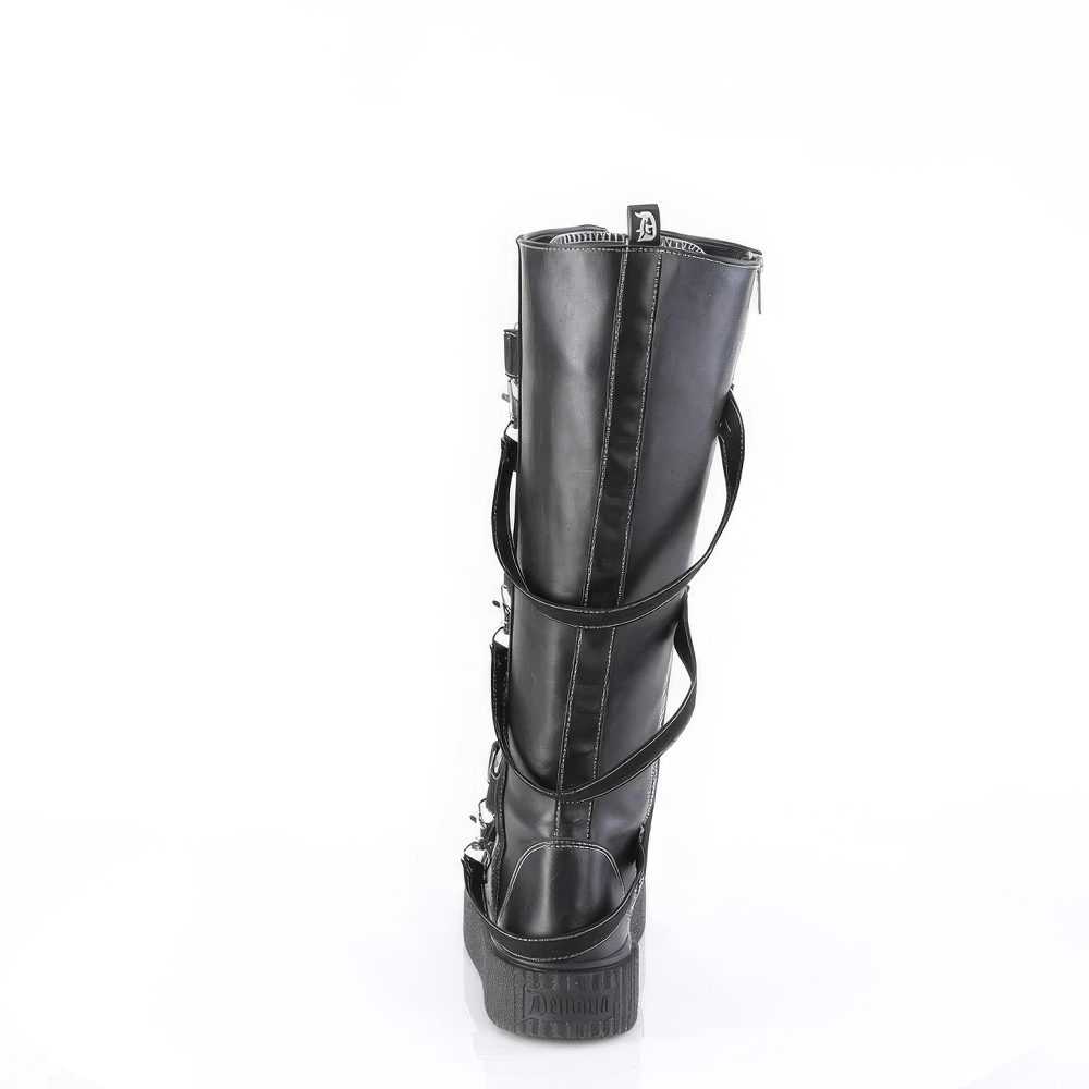 Back view of DEMONIA knee-high platform boots with edgy studded shield straps and lace-up design.