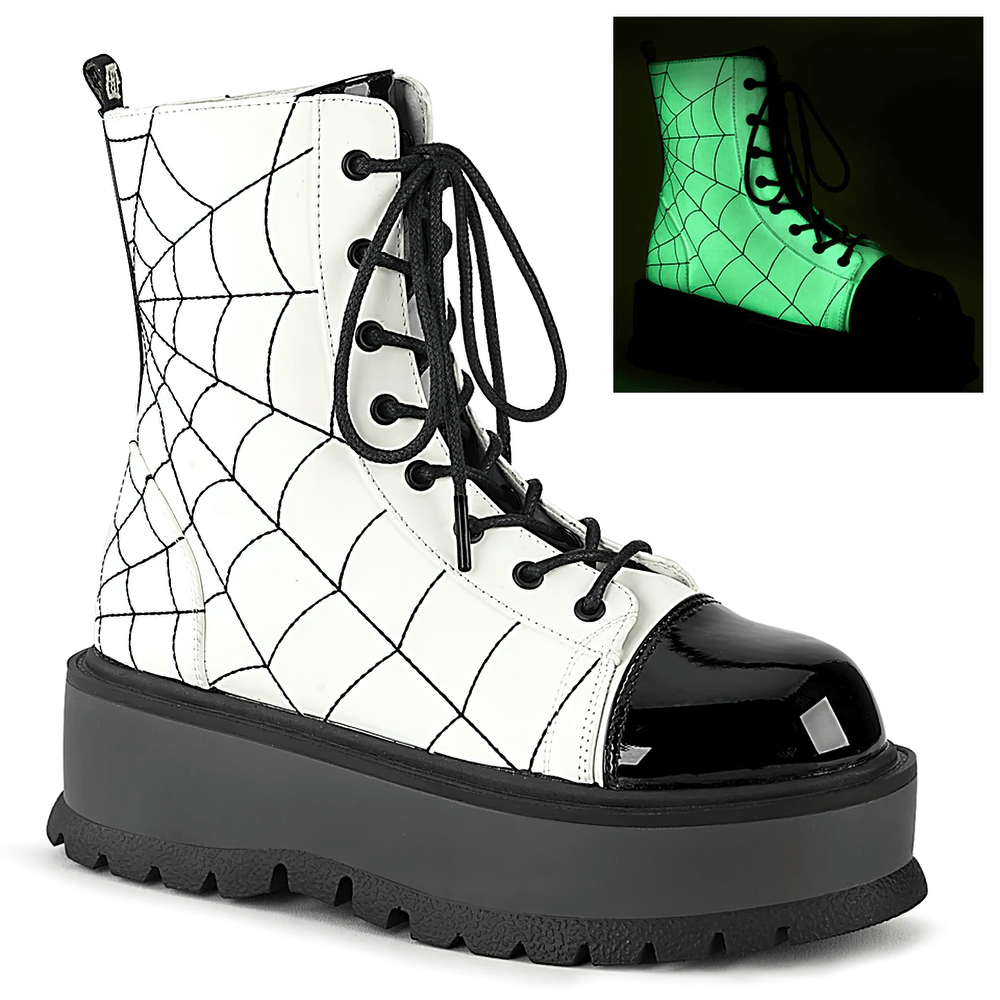 Demonia lace-up ankle boots with embroidered spider web and glow-in-the-dark design on a stylish platform.