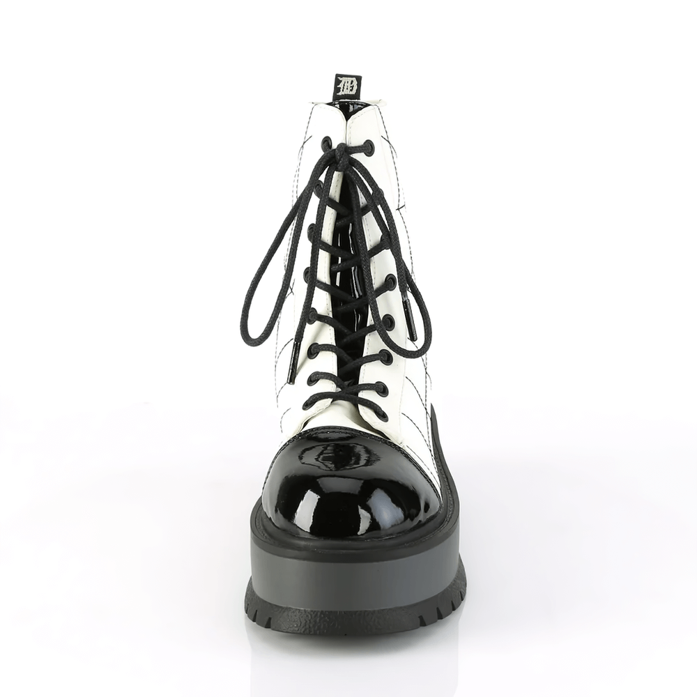Demonia lace-up ankle boots featuring embroidered spider web design on a stylish 2" platform in vegan leather.