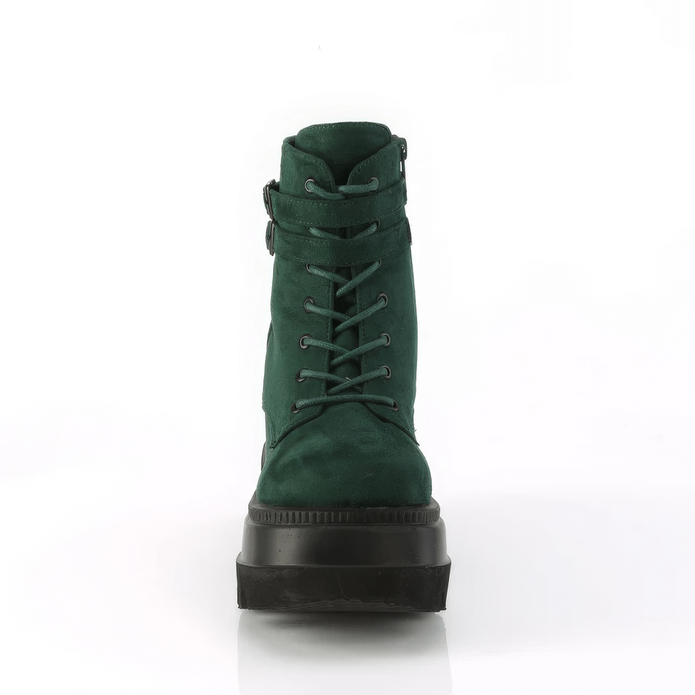 Green DEMONIA lace-up platform ankle boots with buckles, featuring a high 4.5-inch platform and stylish design.