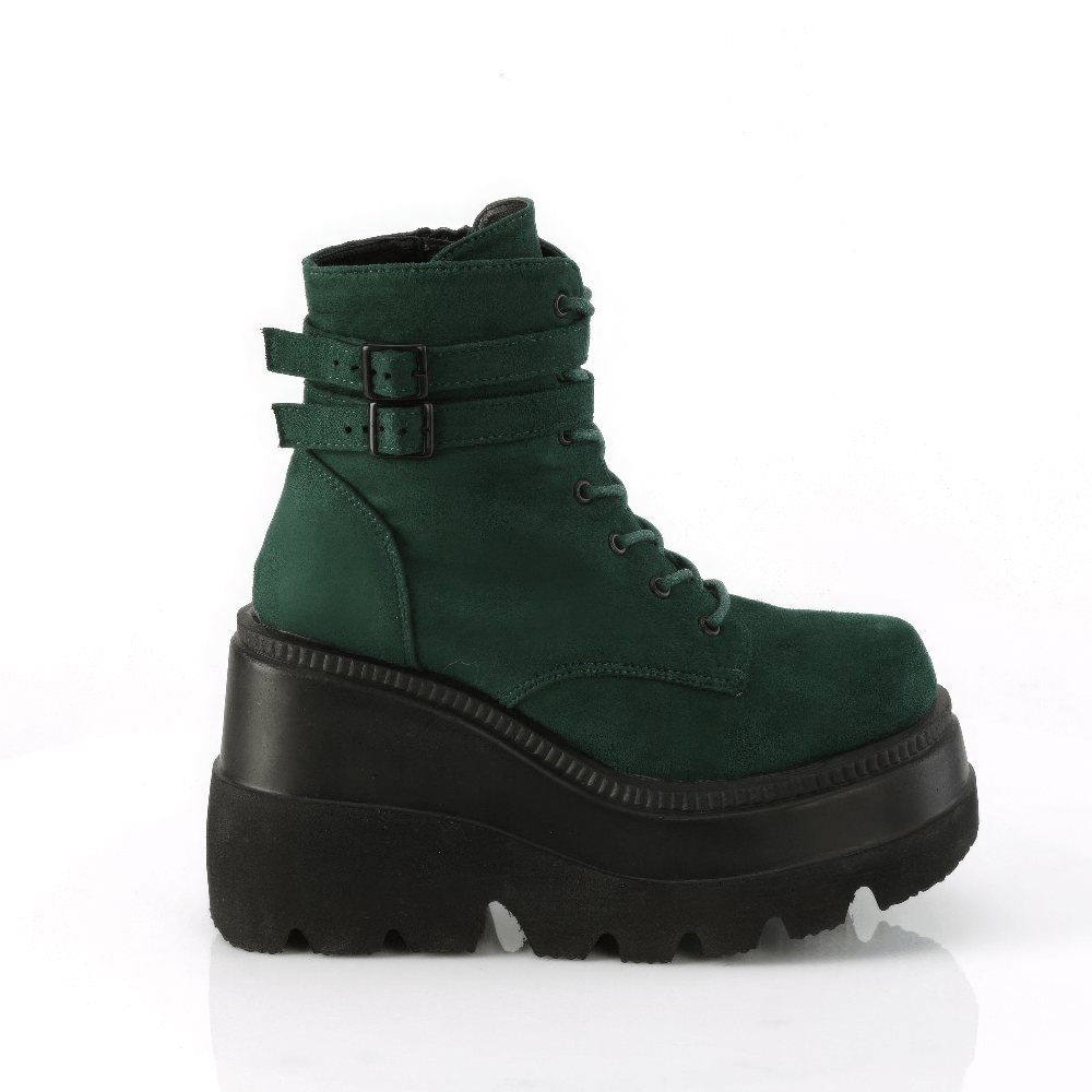 Demonia lace-up platform ankle boots in green vegan suede with buckles and a chunky platform.