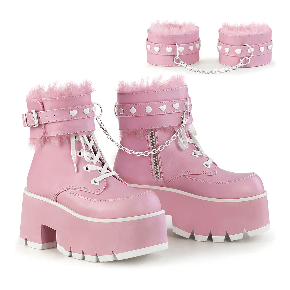 Daring Demonia ladies pink leather platform boots with fur cuffs and heart-studded lace-ups for a bold Pastel Goth look.
