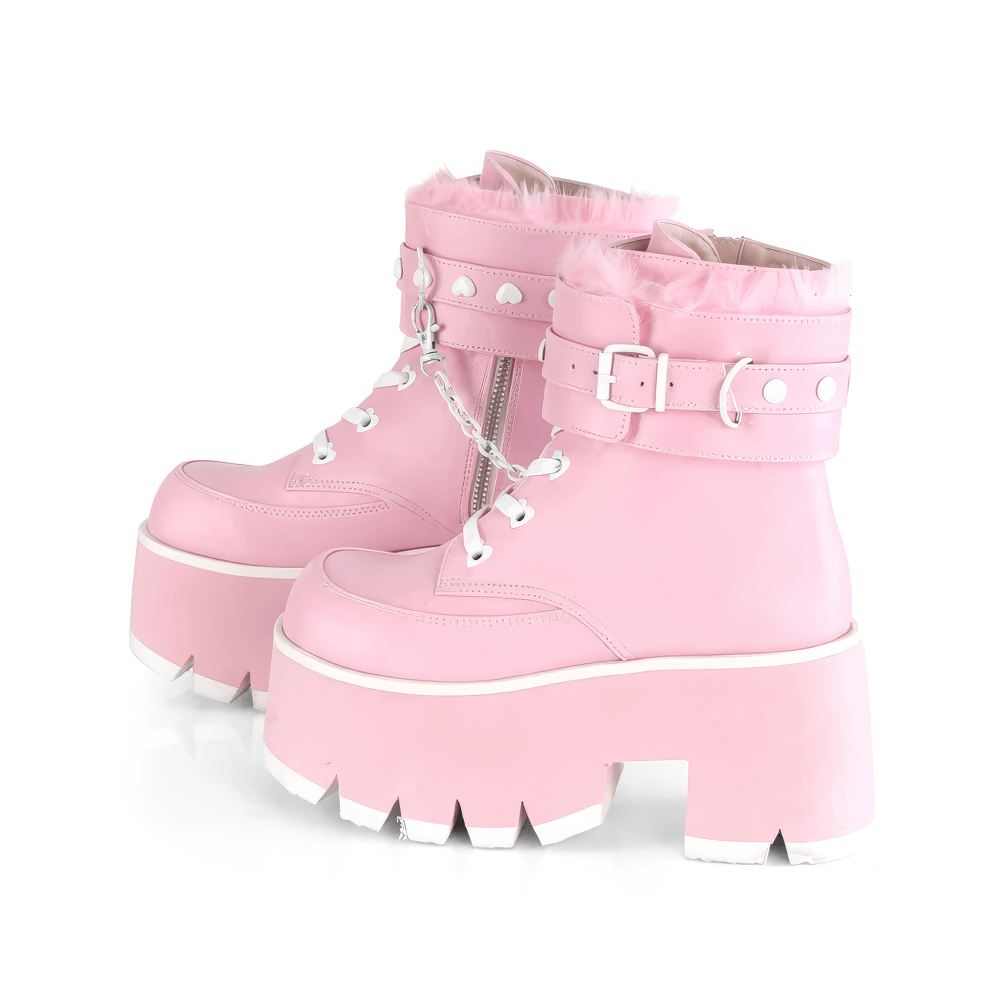 Dare to shine in these Demonia pink leather platform boots with fur cuffs and heart-studded lace-up design.