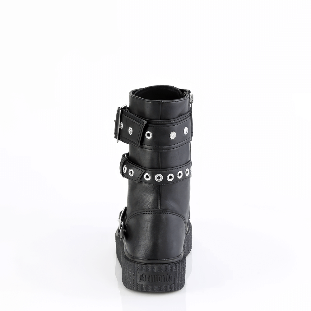 Back view of DEMONIA Mid-Calf Creeper Boots showcasing eyelet buckle straps and rubber sole.