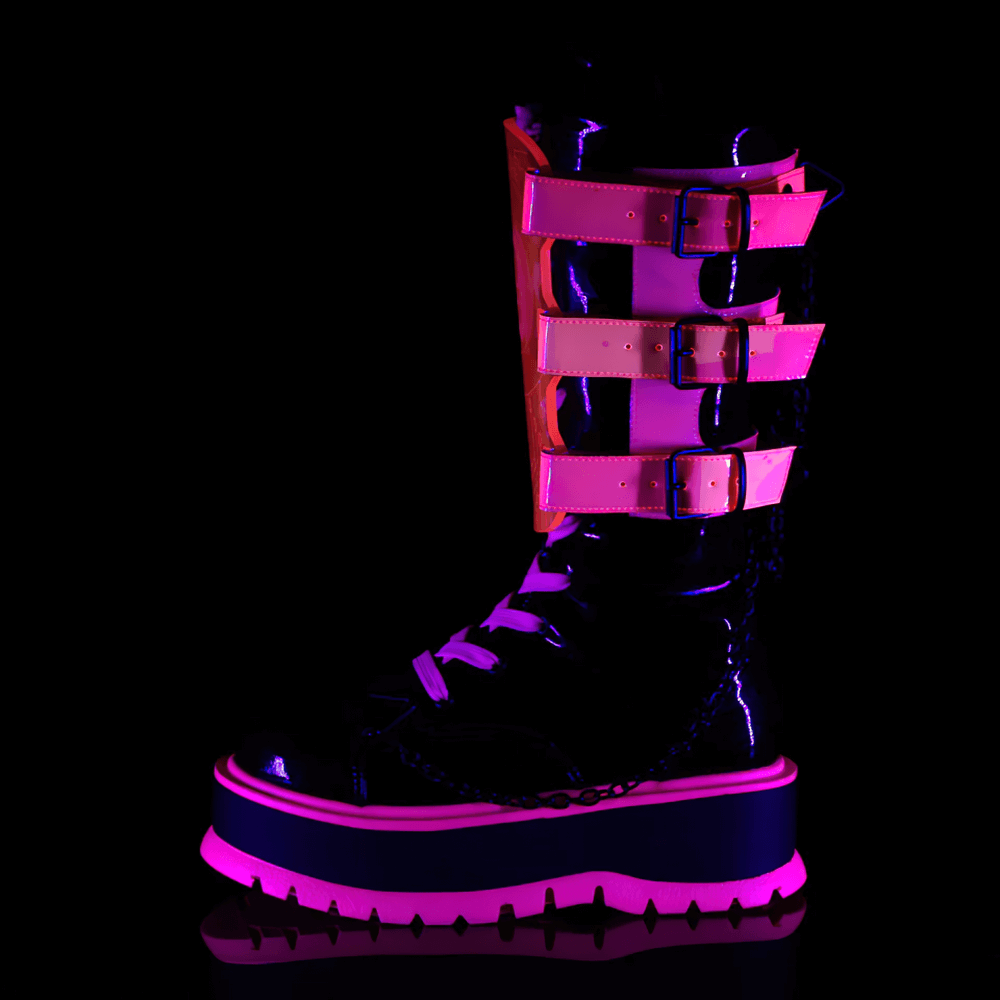 Demonia neon pink platform boots with clear straps, lace-up front, and edgy chain details for alternative style.