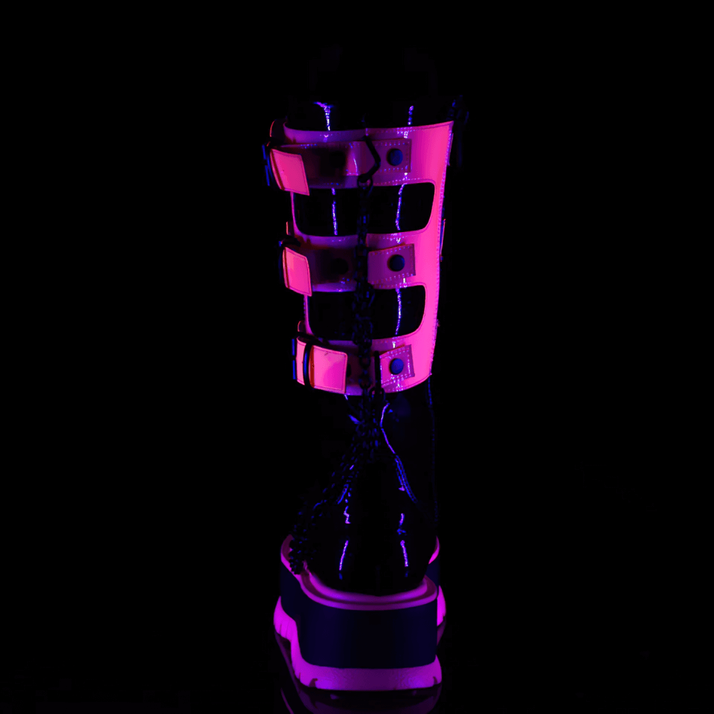 Demonia neon pink platform boots showcasing clear straps and chain detail, perfect for goth fashion under blacklight.