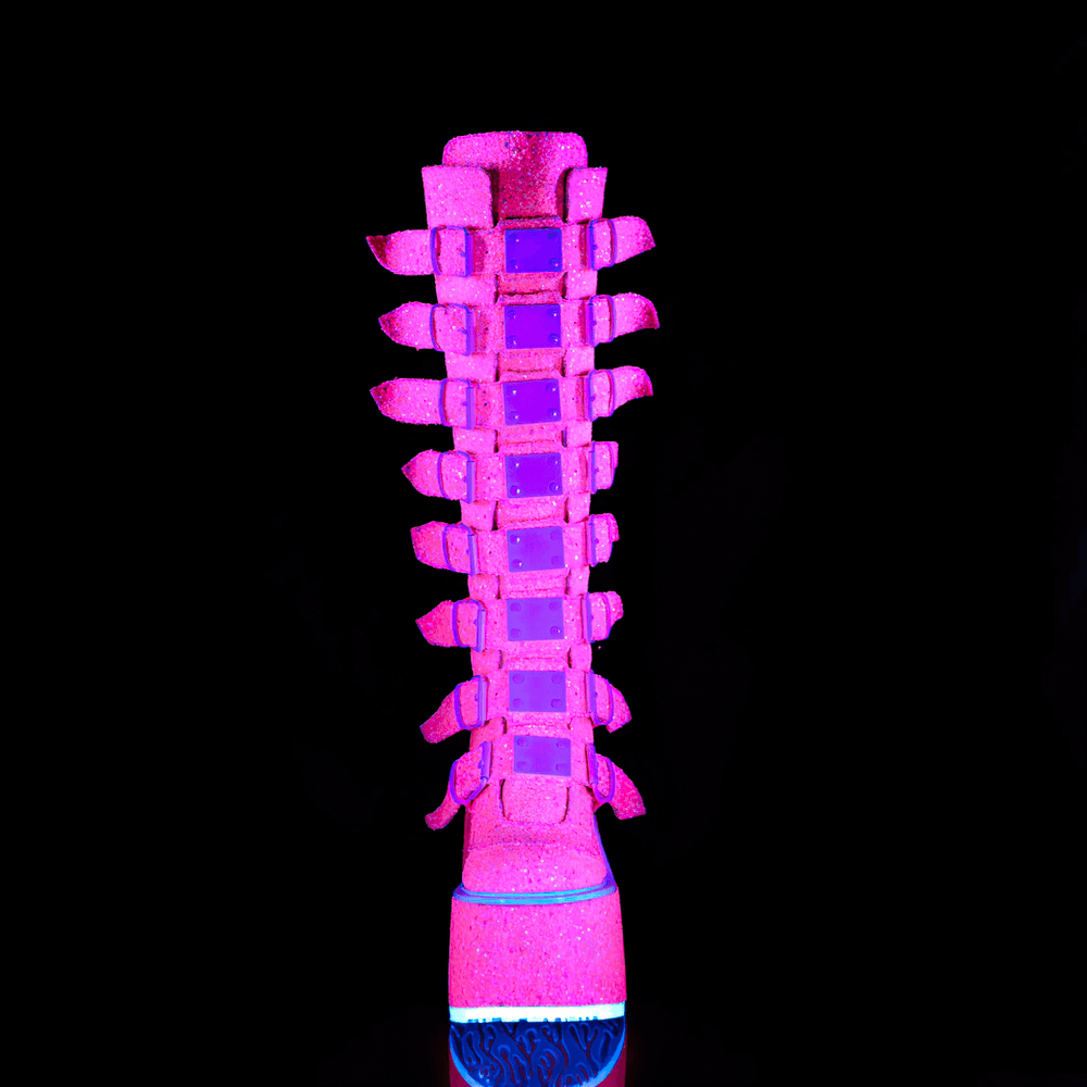 Daring pink glitter knee-high platform boots with eight buckle straps and UV reactive finish.