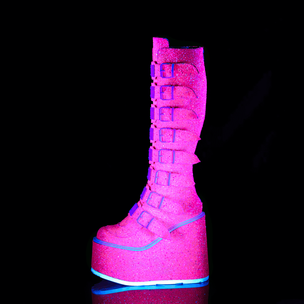 Pink glitter platform knee-high boots with buckles, UV reactive and eye-catching for bold style.