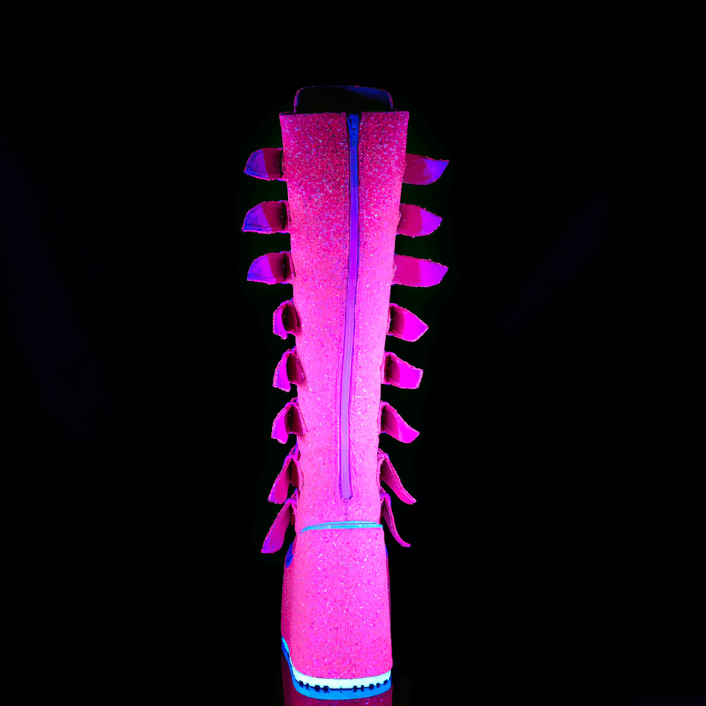 Back view of DEMONIA pink glitter knee-high boots with buckle straps and glowing features.