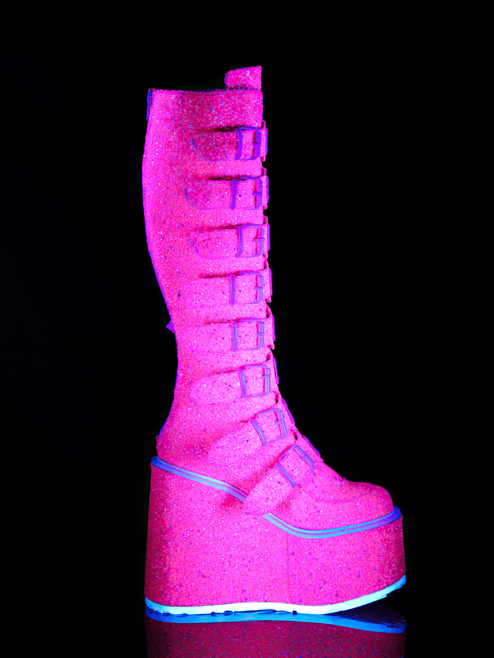 Daring pink glitter platform knee-high boots with buckles, featuring a 5.5 inch platform and UV reactive finish.