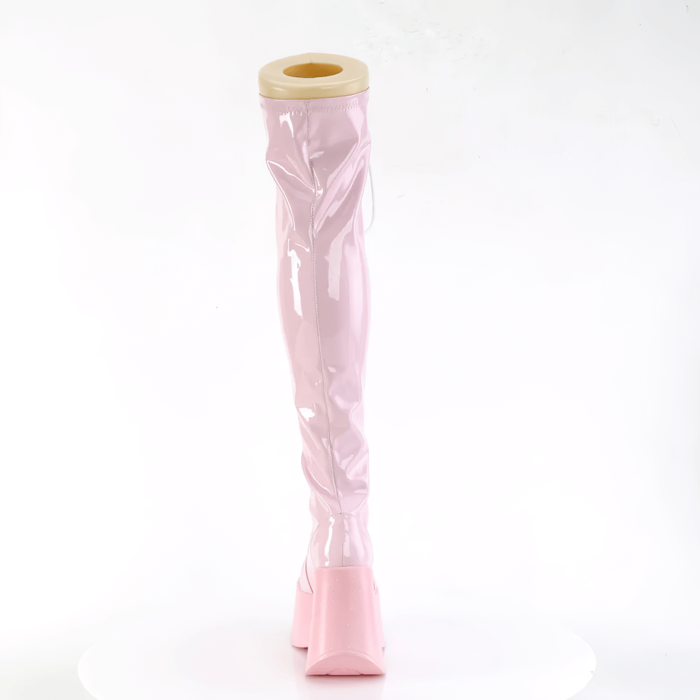Demonia pink holographic thigh-high boots with star platform, showcasing shiny material and bold design.