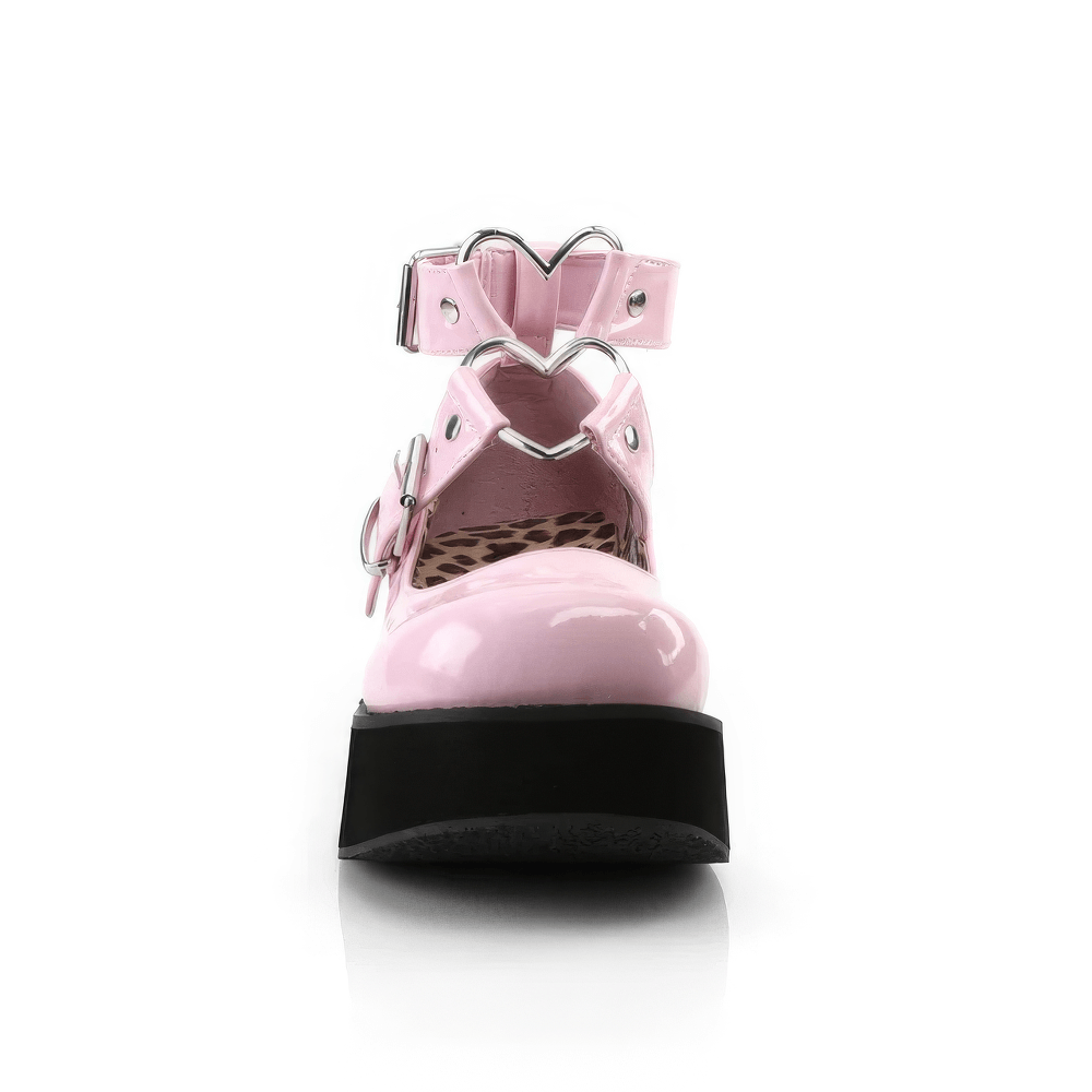 Charming pink patent Mary Jane shoes with heart O-rings and stylish platform design.