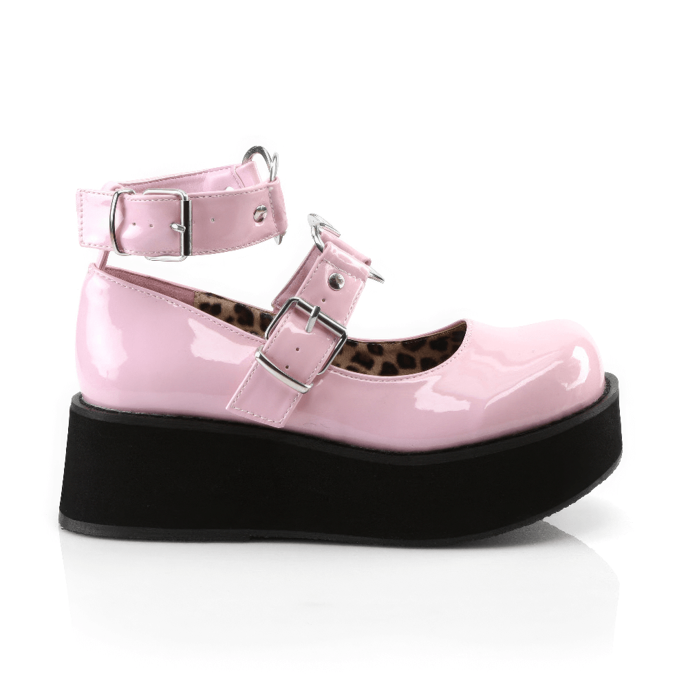 Charming pink patent Mary Jane shoes with heart buckles and a stylish platform, perfect for playful outfits.