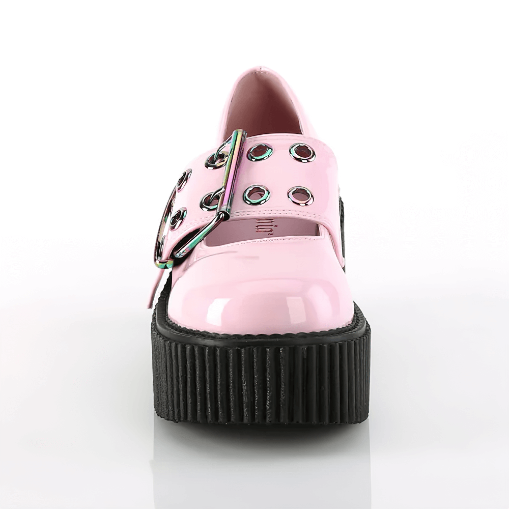 Bold pink platform Mary Jane shoes with rainbow buckle and chunky sole for edgy style.