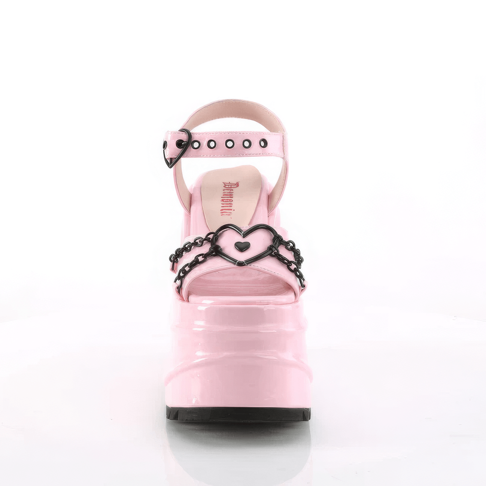 Front view of DEMONIA pink platform sandals featuring heart buckles and chain accents, showcasing playful elegance.