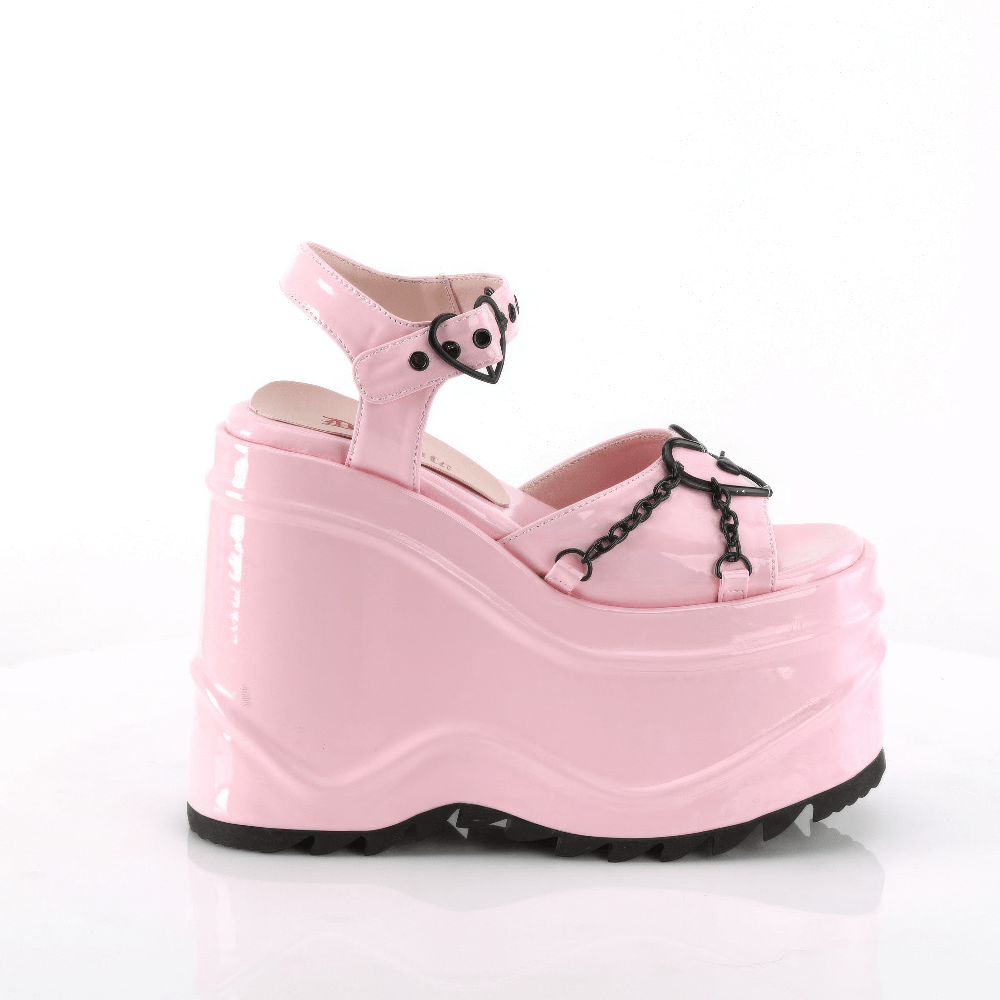 Demonia pink platform sandals with heart buckles and chain accents, stylish and playful footwear.