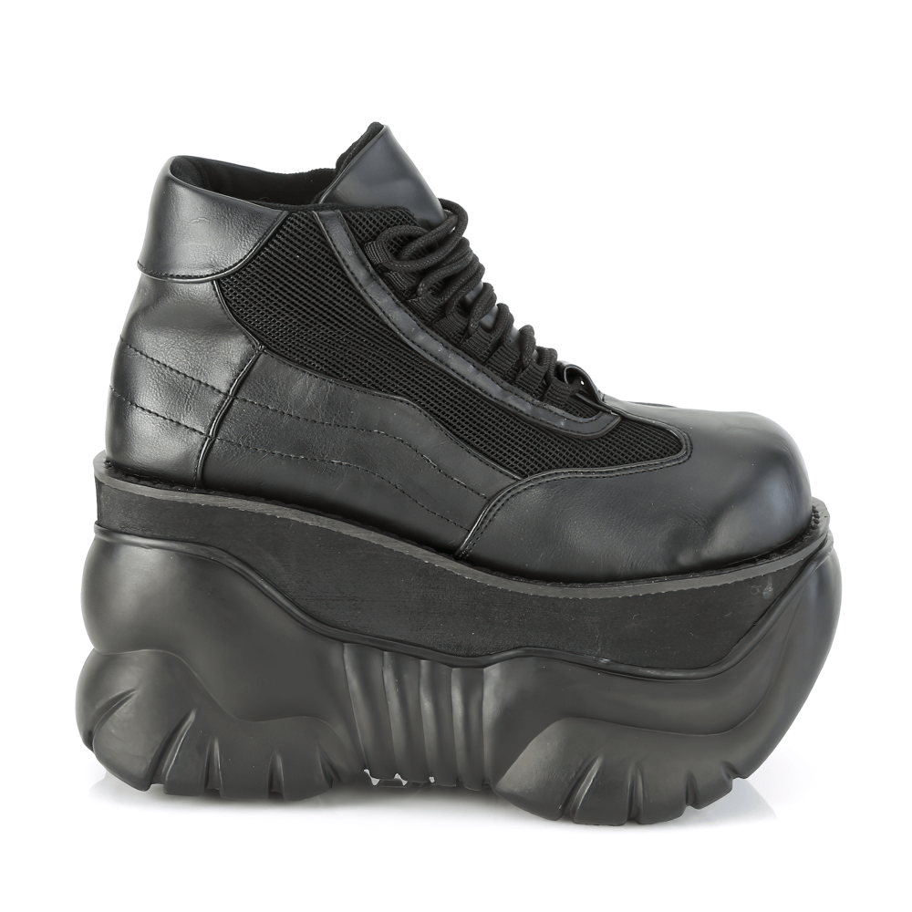 Bold black vegan leather platform sneakers with a chunky 4" sole for a punk cyber vibe.