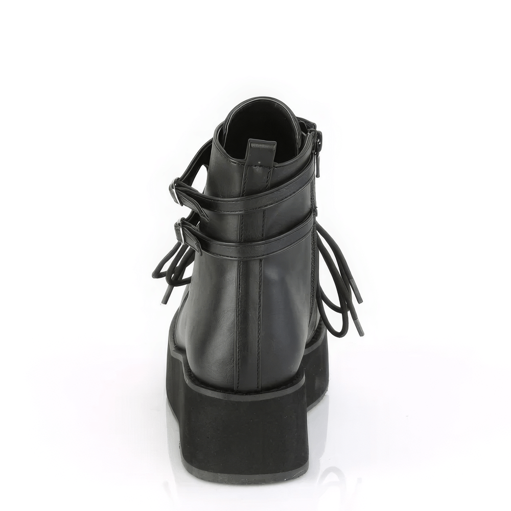 Back view of DEMONIA lace-up ankle boots with adjustable straps and metal lock charm, showcasing vegan leather design.