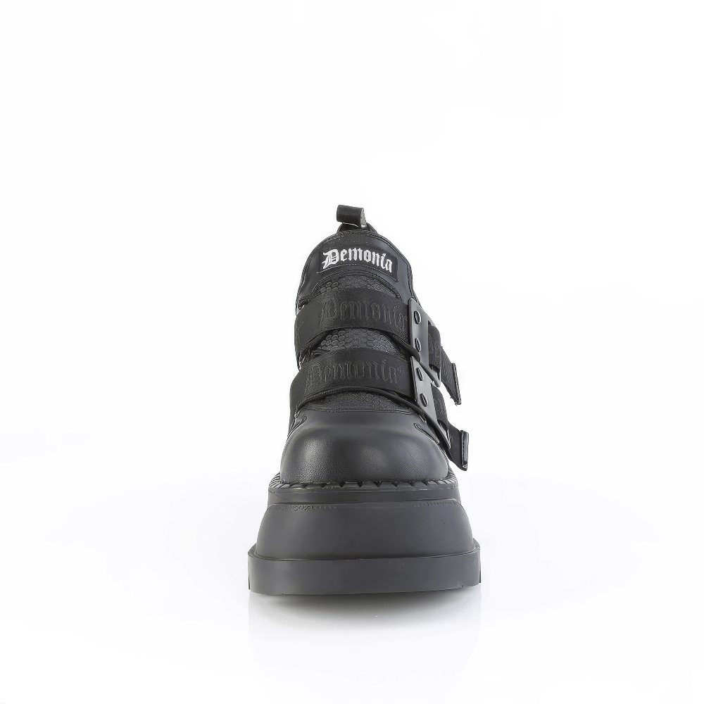 Demonia platform lace-up shoes with metal details and padded ankle straps for a bold, edgy look.