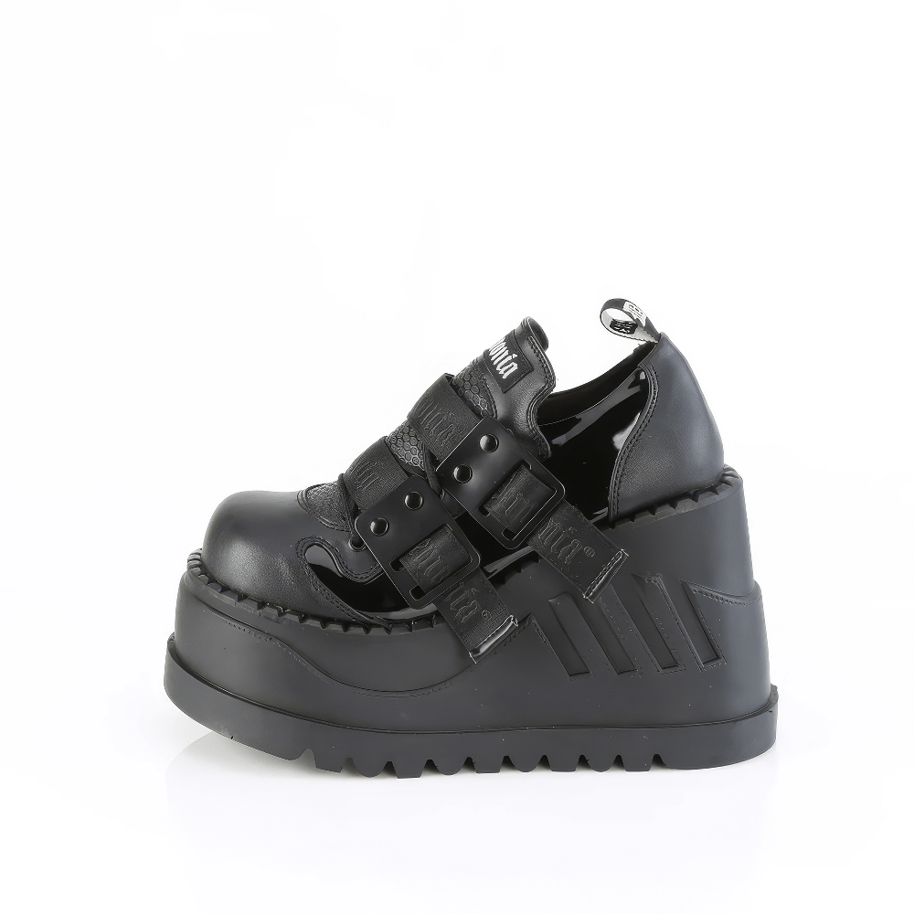 Demonia platform lace-up shoes with metal details and 4.75-inch wedge heel, perfect for edgy fashion statements.