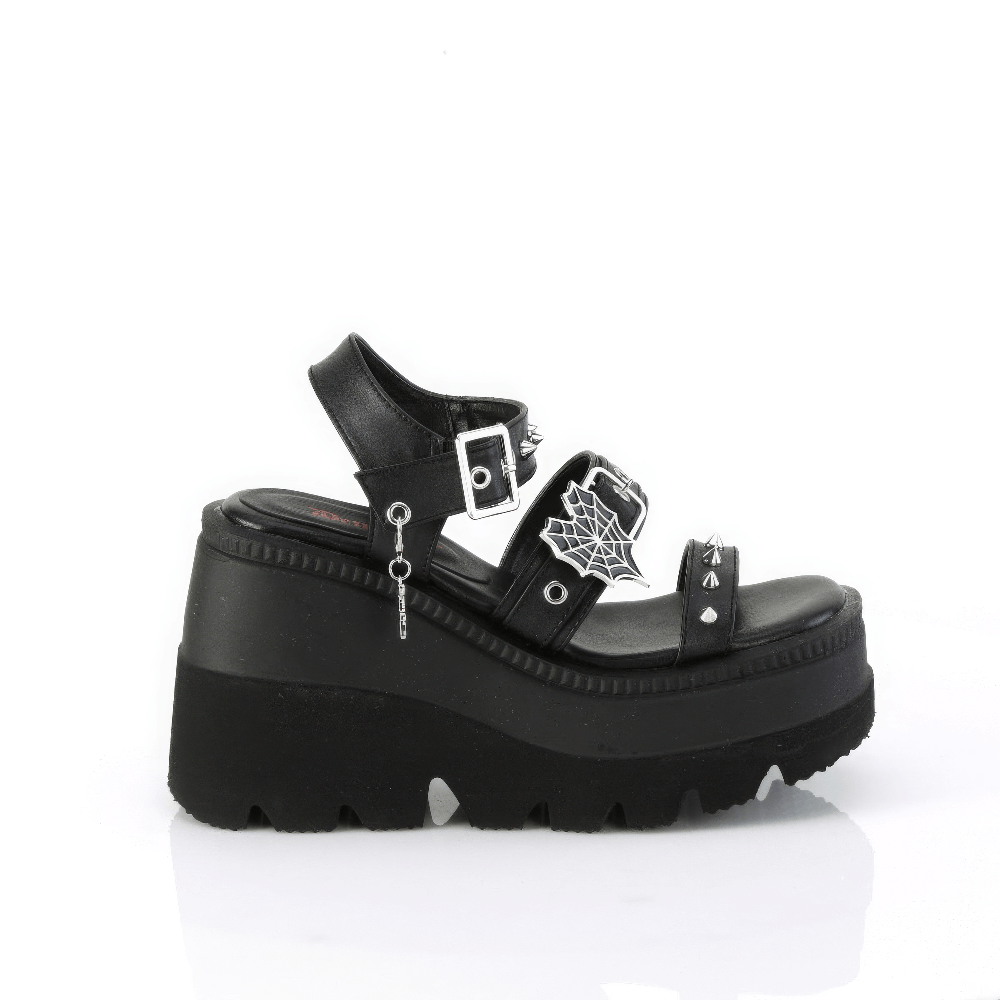 Black Demonia platform sandals with spikes and spider web charm, stylish and edgy footwear.