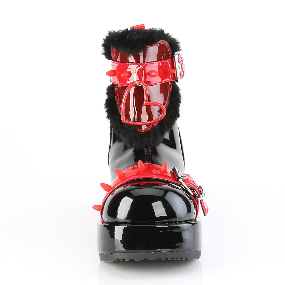 Demonia ankle boots with fur trim, red buckle, and black platform, featuring spiky details for a bold statement.