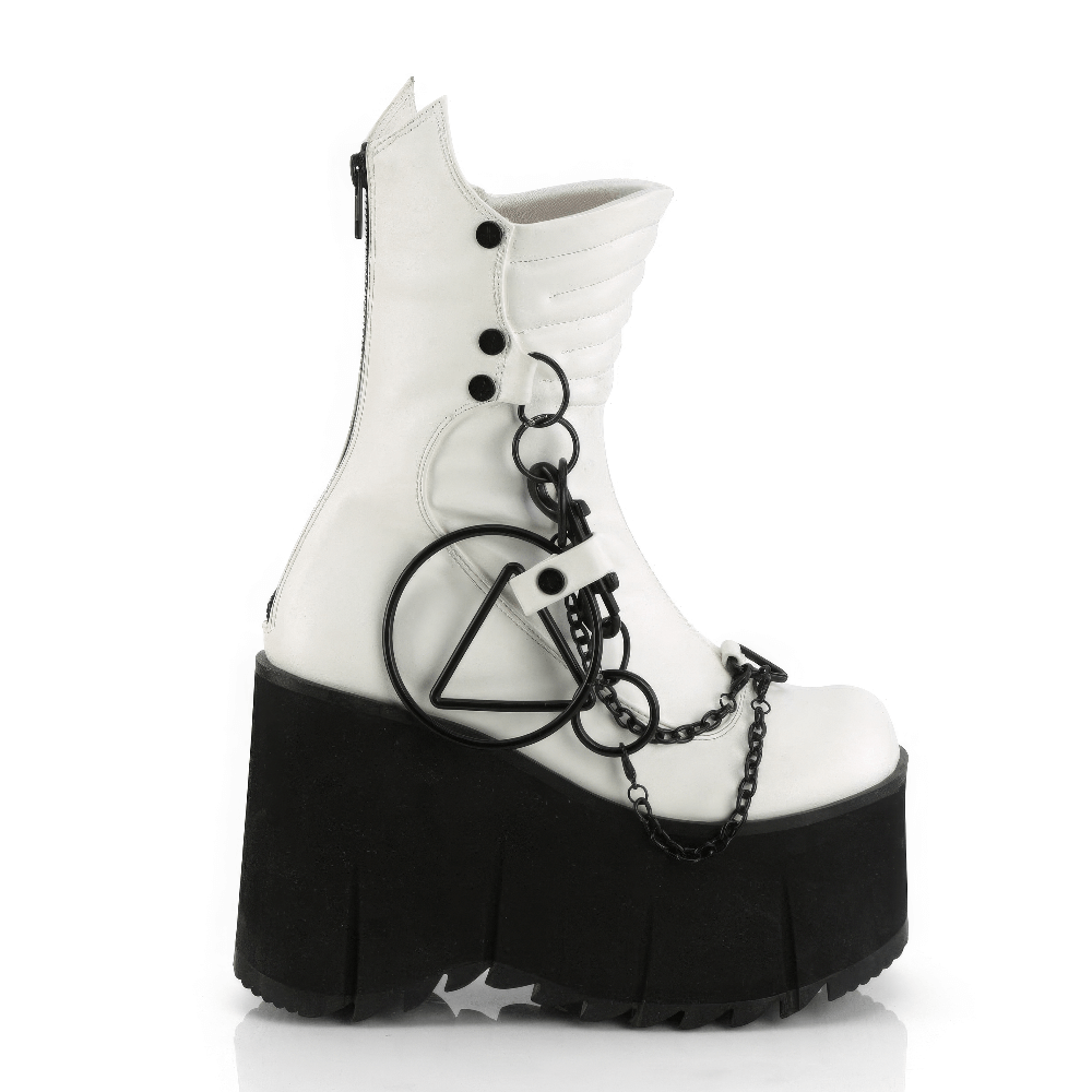 White vegan mid-calf platform boots with chains and studs, featuring stylish quilting and prominent metal hardware.
