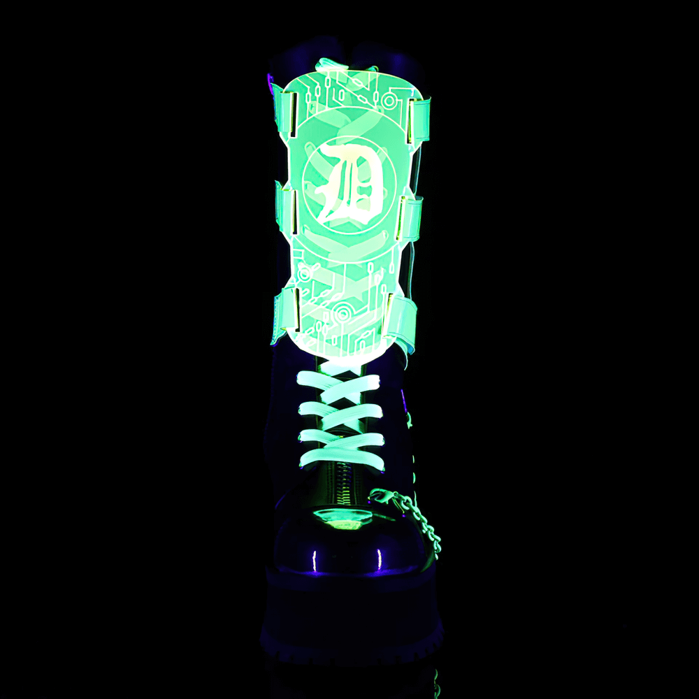 Futuristic UV-reactive mid-calf boots with silver toe cap and chain details, glowing in blacklight.