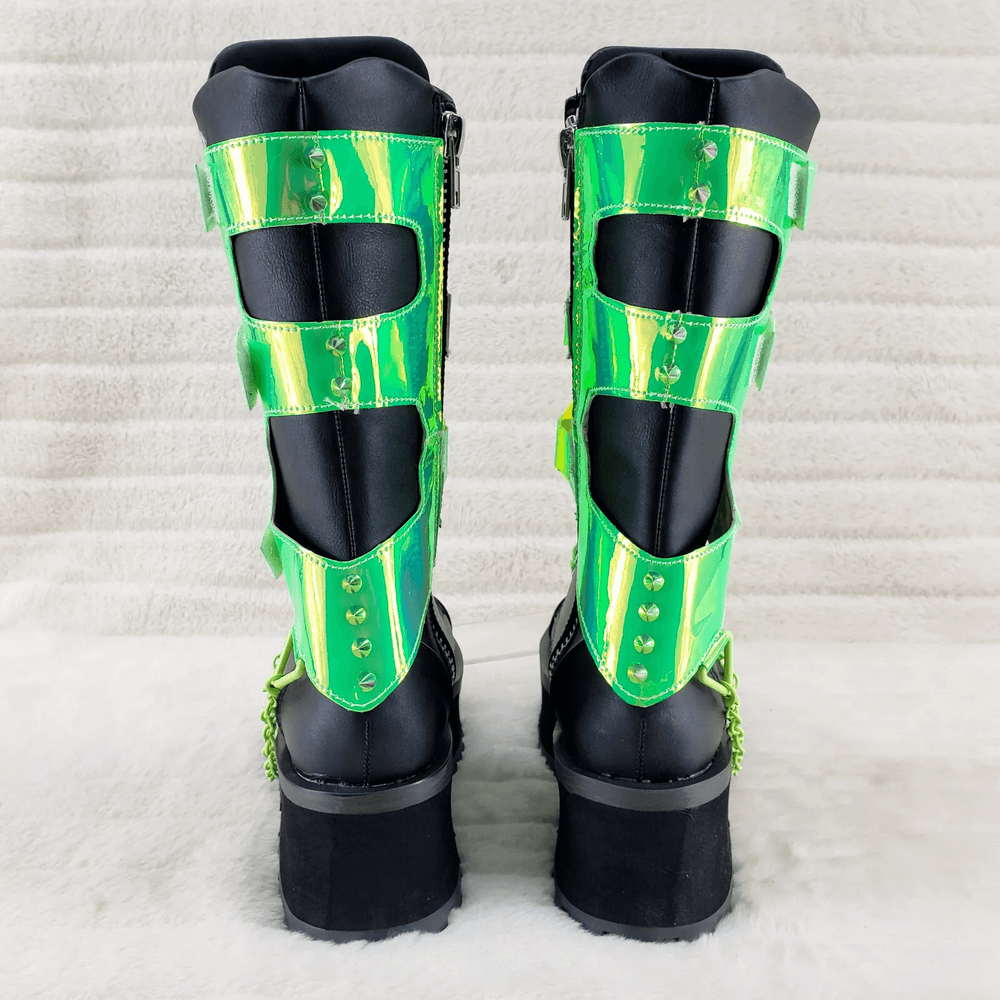 Back view of Demonia punk mid-calf boots with UV-reactive green straps and pyramid chain details.