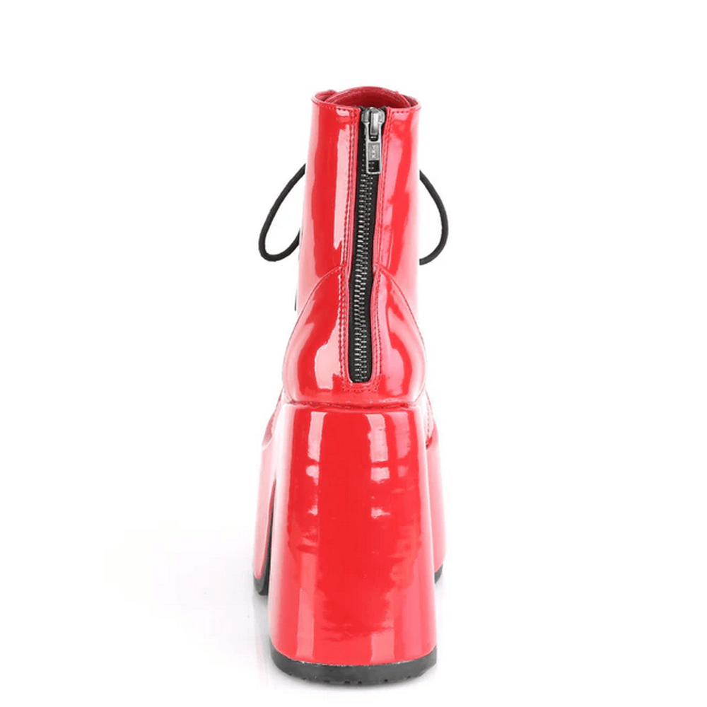 Bold red ankle platform boots with chunky heel and lace-up design, showcasing a striking patent finish.