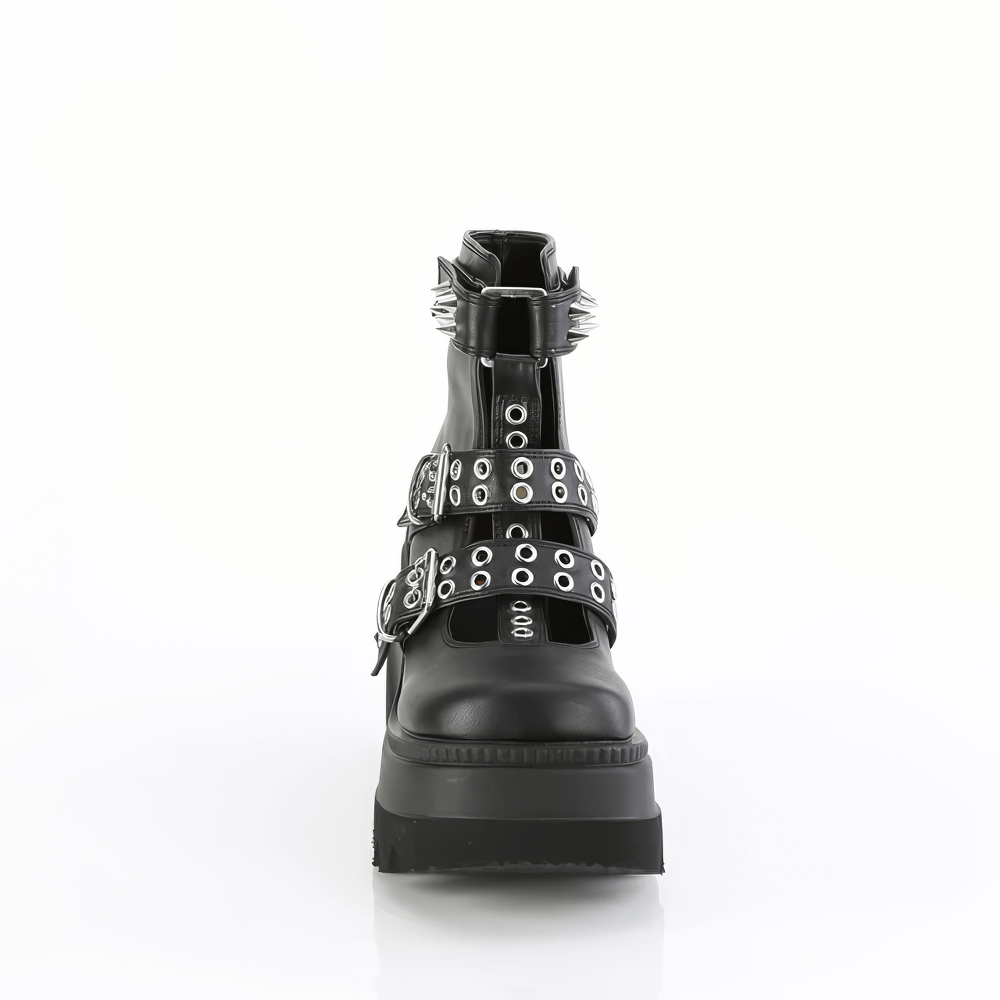 Demonia black platform ankle boots with spike adornments and double buckle straps, showcasing edgy style.