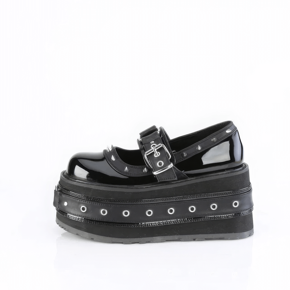 Demonia Spiked Platform Mary Jane shoes with buckle, cone spikes, and eyelet details on a bold platform.