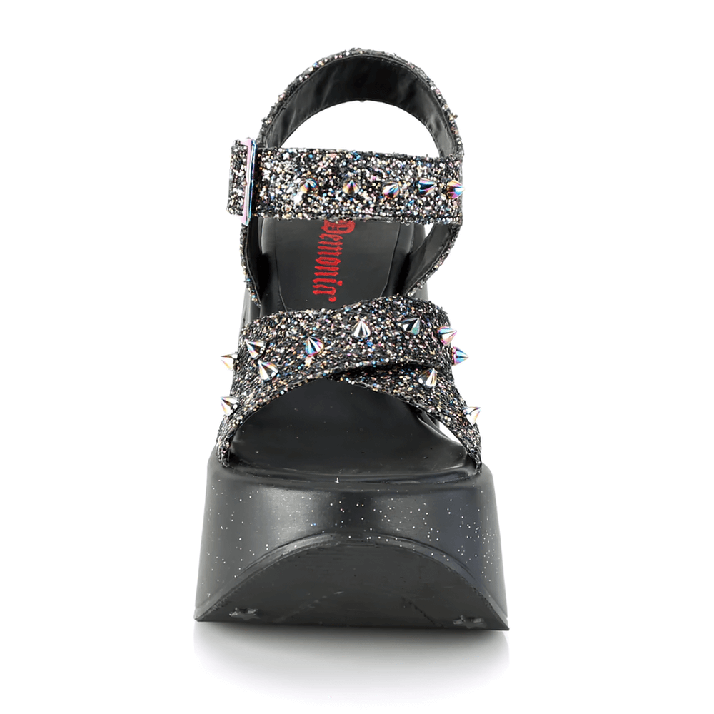 Demonia Star Cutout Glitter Wedge Sandals featuring spikes and criss-cross straps, perfect for daring fashion statements.