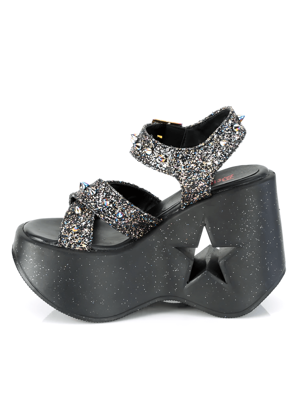 Demonia star cutout glitter wedge sandals with spikes, featuring criss-cross straps and a bold 5-inch heel.