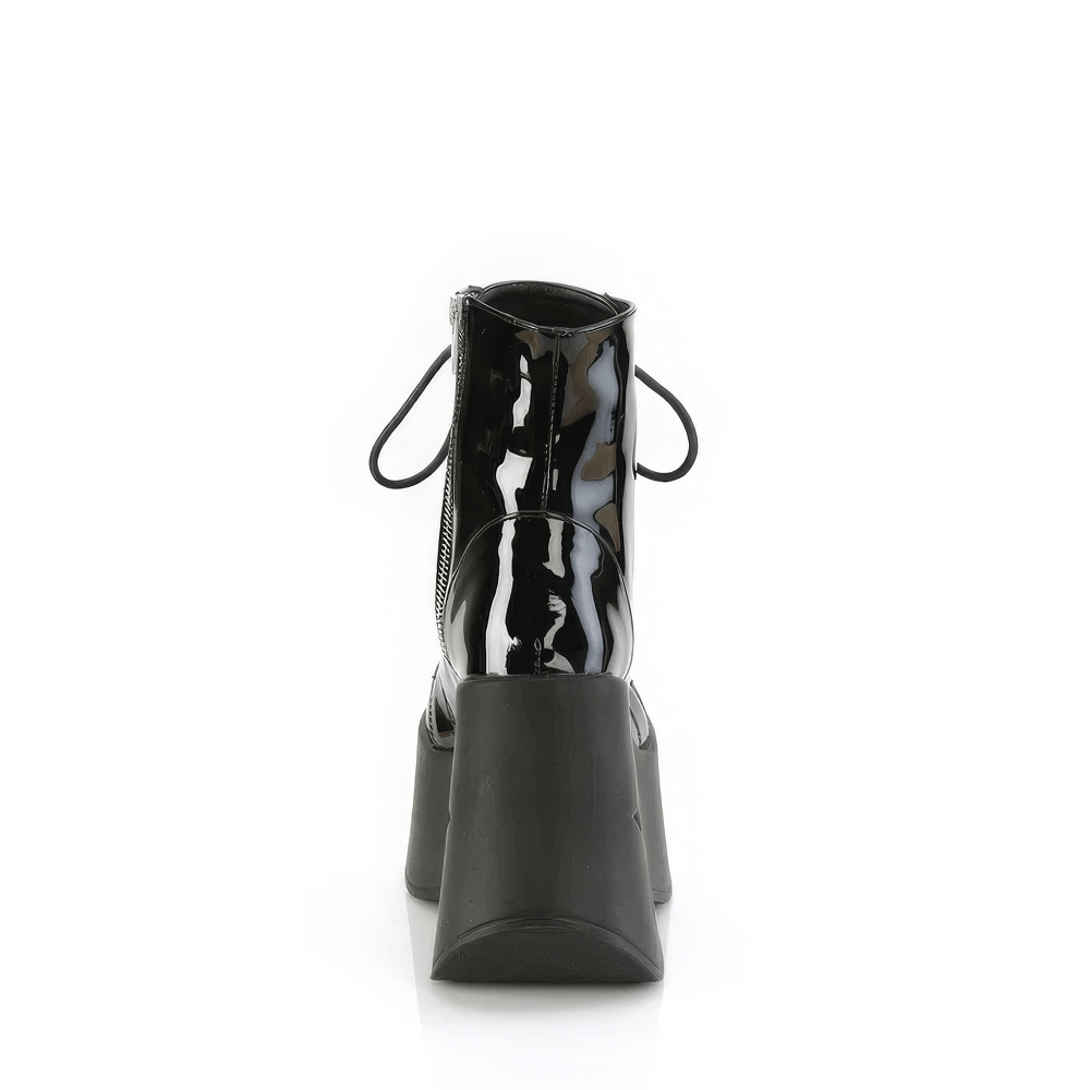 Back view of DEMONIA Star Cutout Platform Lace-Up Ankle Boots in black patent vegan leather, showcasing striking platform design.