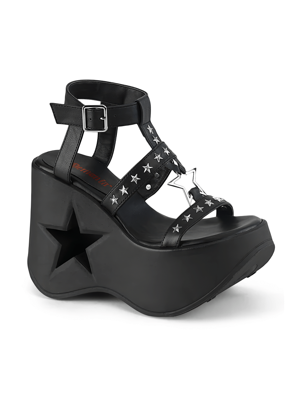 Daring black platform wedge sandals with star cutouts, wrap-around straps, and silver-tone star studs.