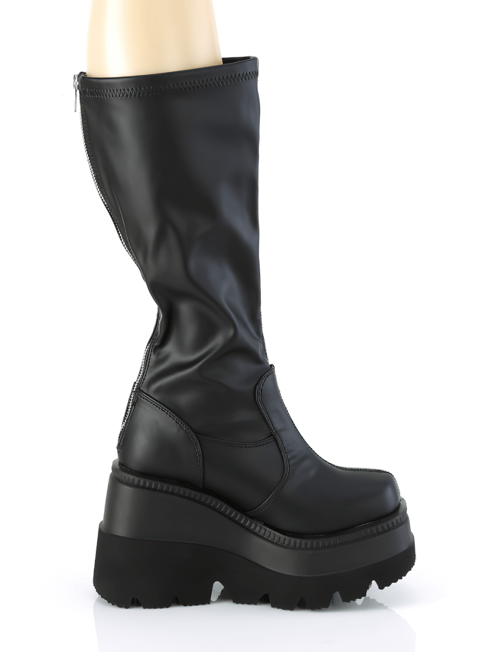 Demonia knee-high wedge boots in black with back zip and wide calf fit, featuring a chunky platform.