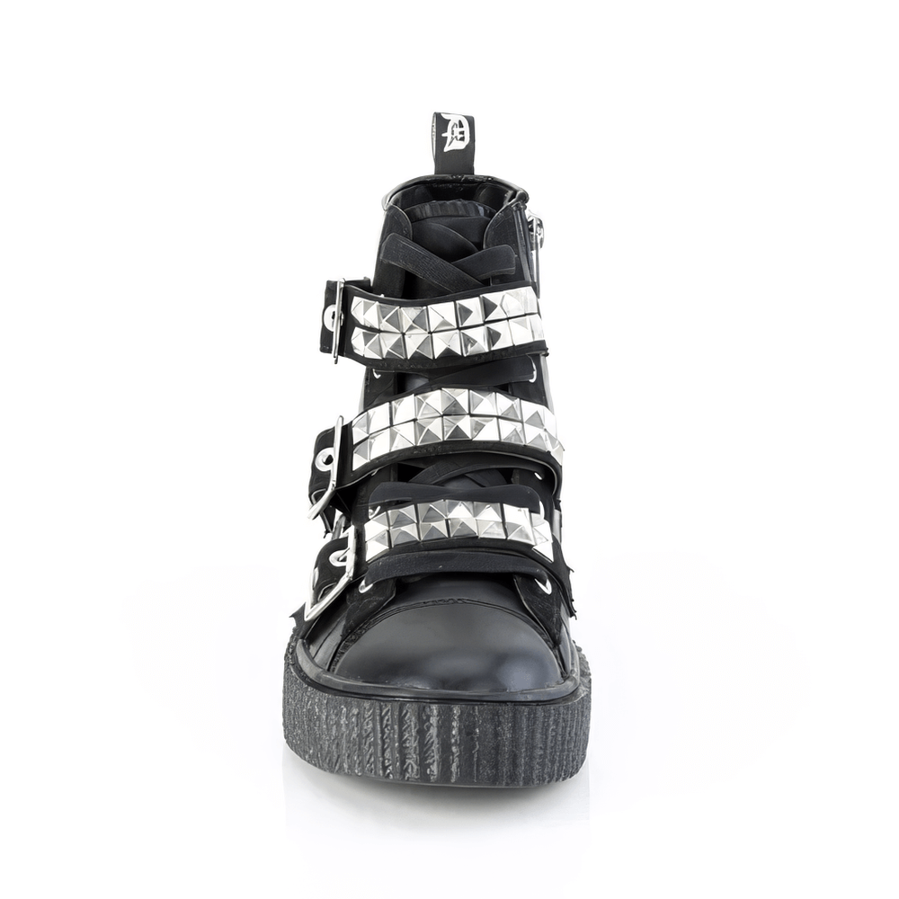 Demonia studded high-top creeper sneakers with buckles and pyramid studs, showcasing edgy punk rock style.