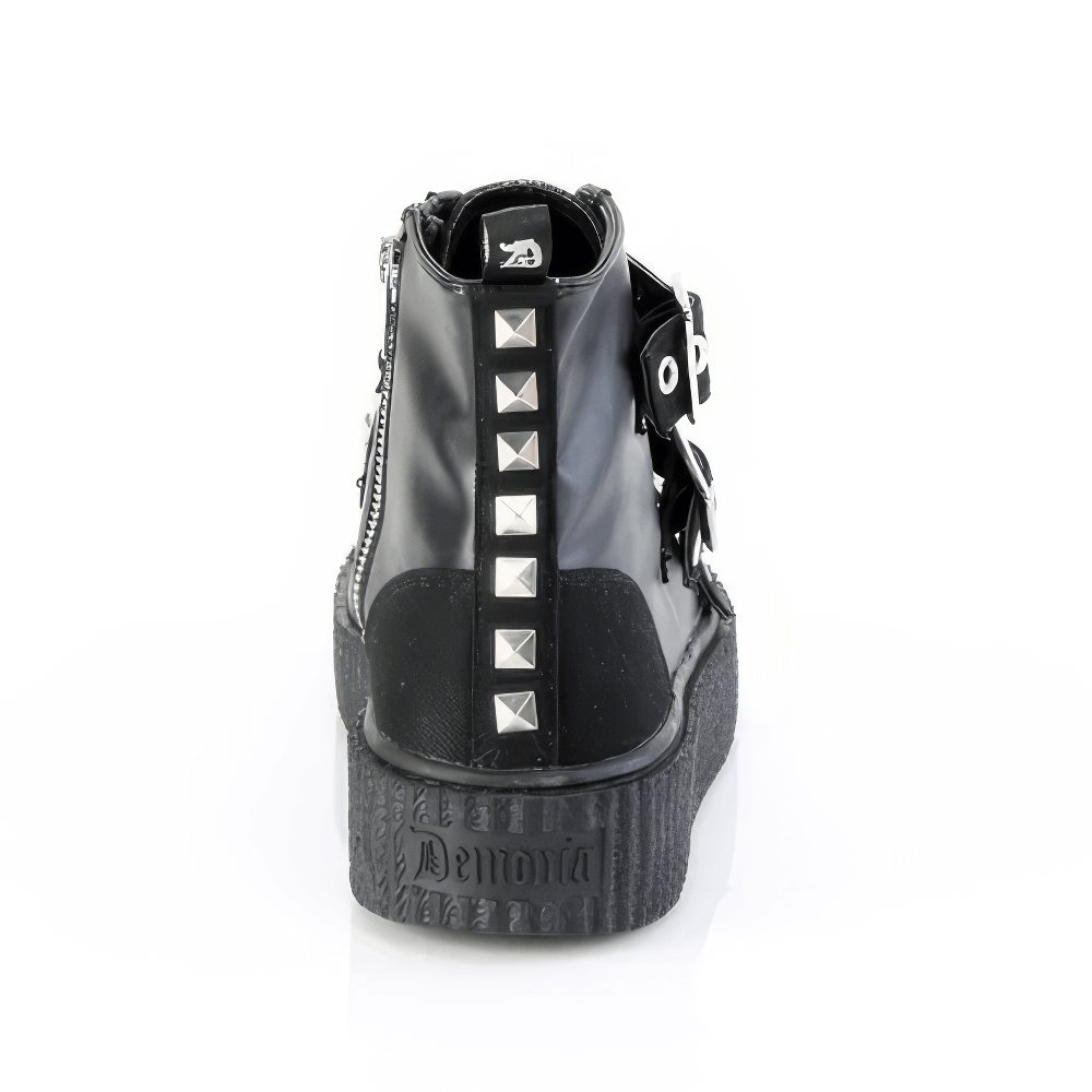 Back view of DEMONIA studded high-top creeper sneakers featuring pyramid studs and buckle straps.