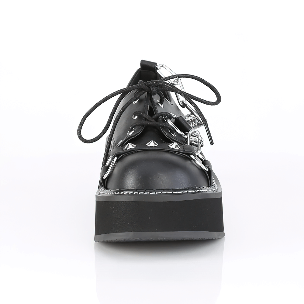 Black studded platform shoes with lace-up design and spike embellishments for a bold fashion statement.