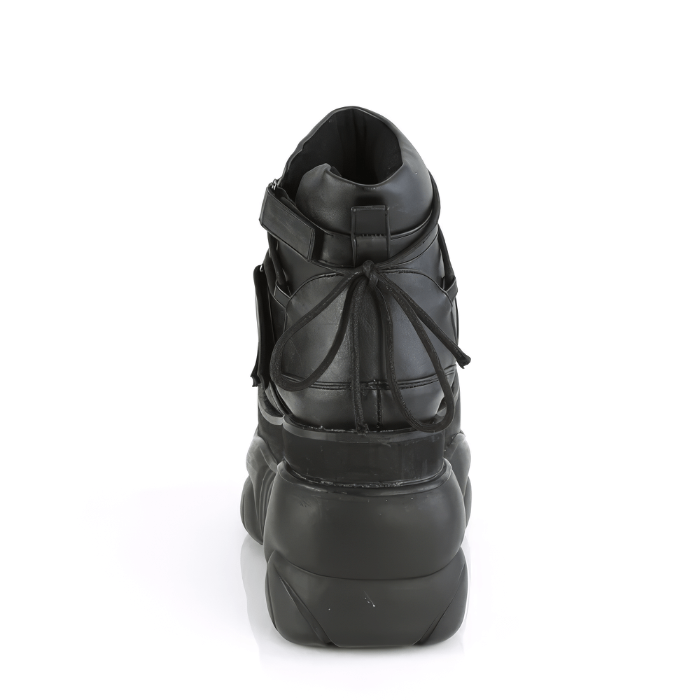 Back view of DEMONIA unisex black ankle bootie featuring hook straps and a 4" platform for bold, stylish wear.