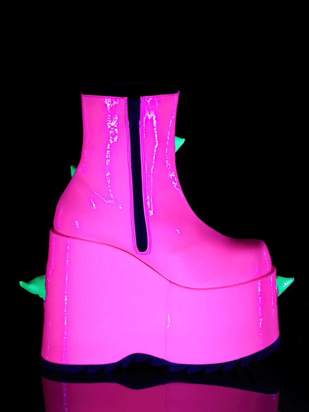 Daring DEMONIA UV neon pink wedge platform boots with green spikes, perfect for bold fashion statements.