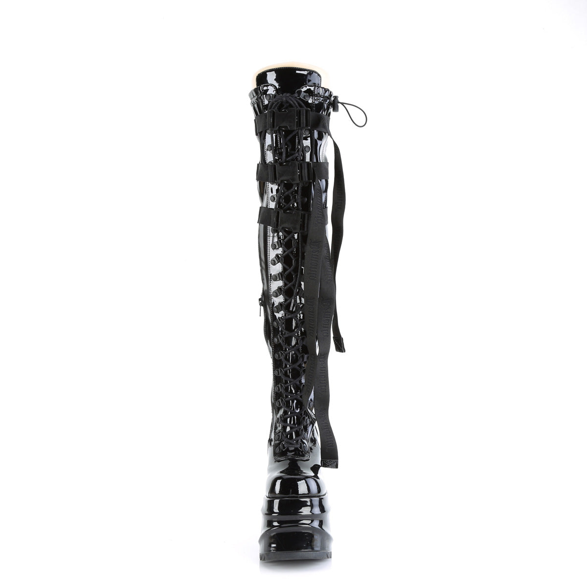 Black lace-up thigh-high boots with stretchy patent finish and branded nylon strap accents, showcasing bold wedge detail.