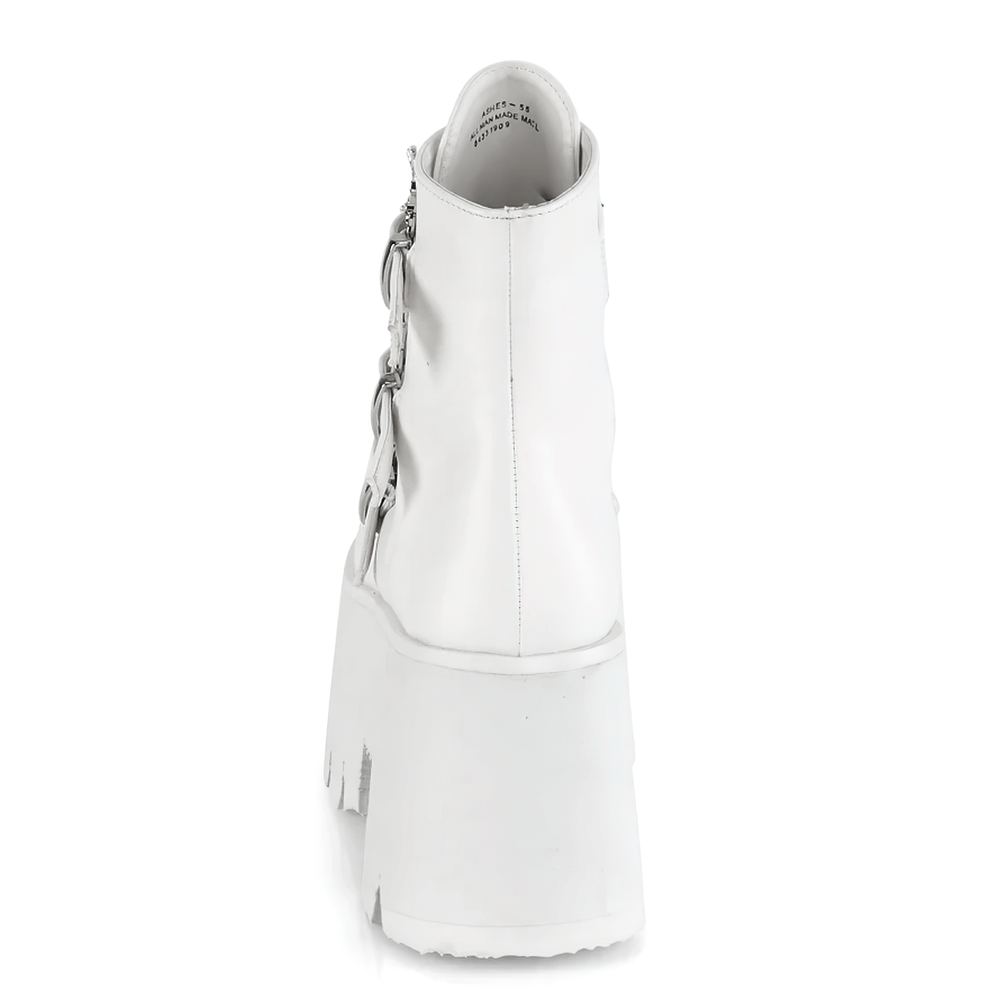 Back view of DEMONIA white ankle boots featuring a chunky heel and bat buckle details.