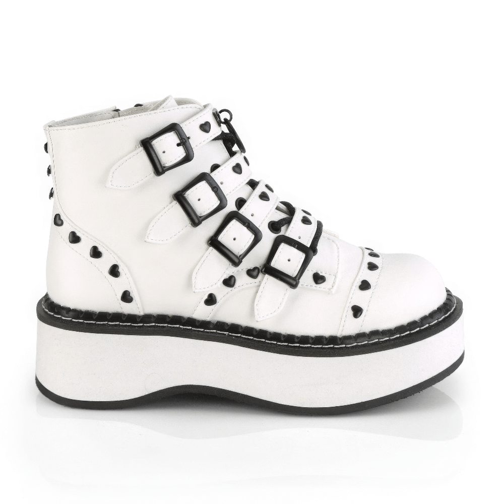 Demonia white platform buckle strap ankle boots with heart studs, featuring lace-up front and O-ring detail.