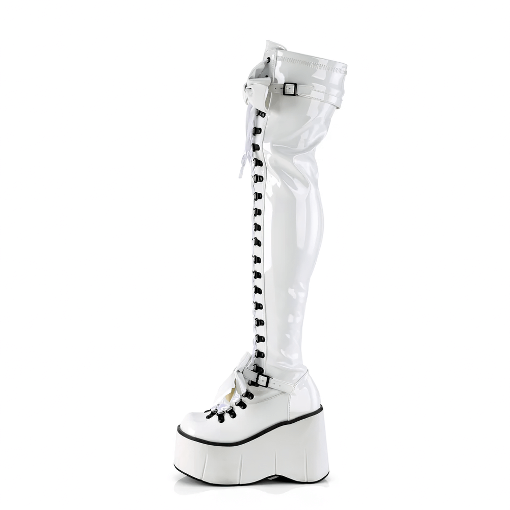 Demonia white thigh-high boots with lace-up design, platform wedge, and adjustable straps for bold style.